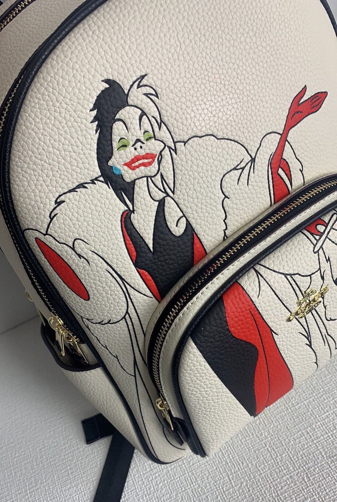 Coach X Disney (CC158) Cruella Motif Mini Pebbled Leather Court Backpack Bag